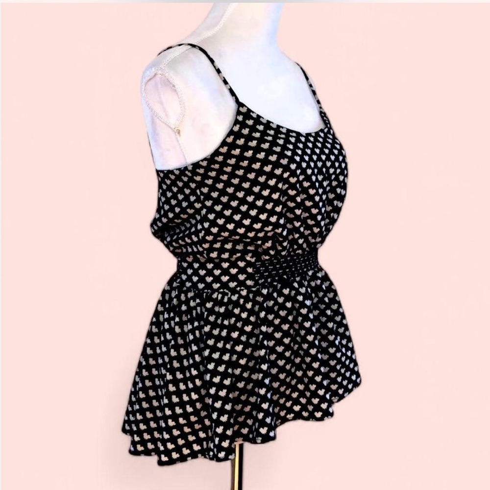 Peplum top with bow tie print